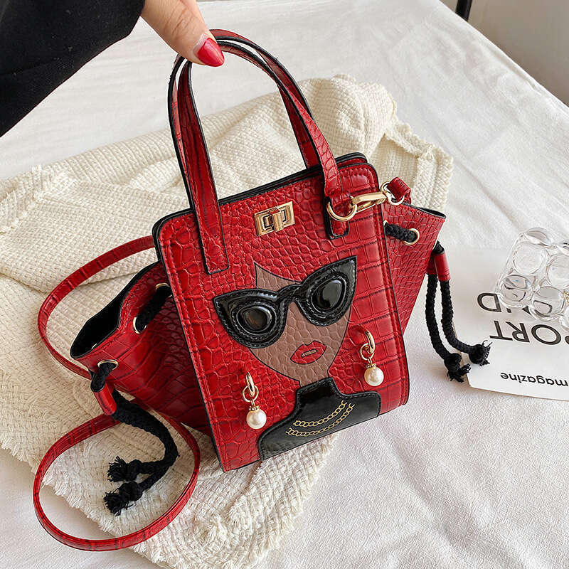 Stone patterned niche crossbody women's cartoon girl glasses handbag, fashionable shoulder bag, 2024 new casual versatile fashion clothing