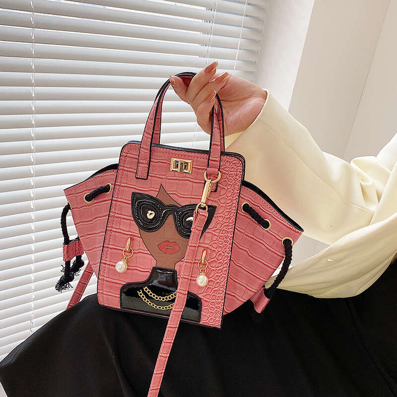 Stone patterned niche crossbody women's cartoon girl glasses handbag, fashionable shoulder bag, 2024 new casual versatile fashion clothing