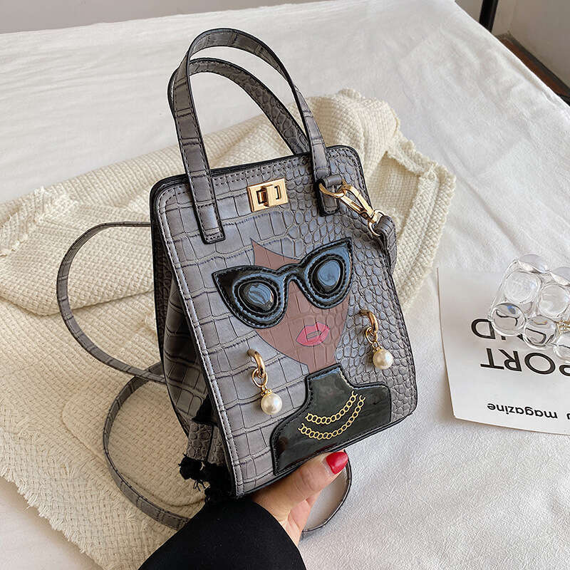 Stone patterned niche crossbody women's cartoon girl glasses handbag, fashionable shoulder bag, 2024 new casual versatile fashion clothing