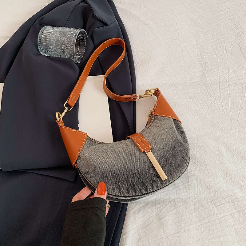 Advanced denim commuting women's style armpit dumpling French texture cow horn crescent bag, 2024 new casual fashion trend clothing