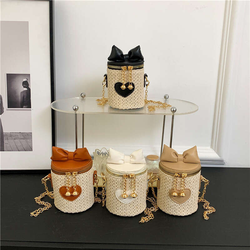 2025 New Bohemian Mini Splicing Straw Water Bucket Women's Crossbody Woven Chain Bow Bag