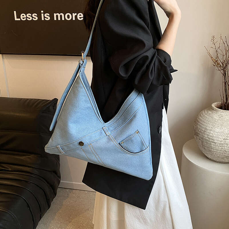 High end denim commuting crossbody large capacity women's internet famous spicy girl single shoulder armpit bag 2024 new casual fashion trend clo
