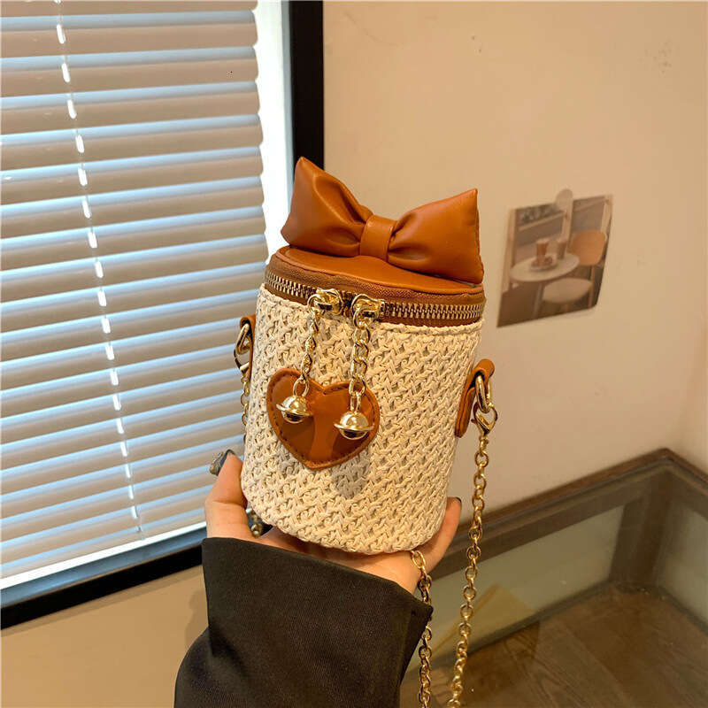 2025 New Bohemian Mini Splicing Straw Water Bucket Women's Crossbody Woven Chain Bow Bag