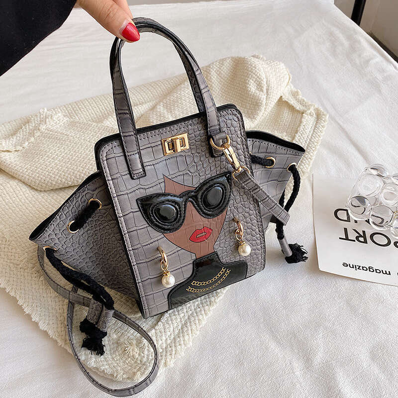 Stone patterned niche crossbody women's cartoon girl glasses handbag, fashionable shoulder bag, 2024 new casual versatile fashion clothing