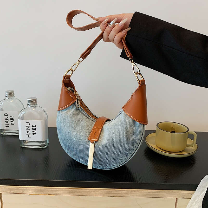 Advanced denim commuting women's style armpit dumpling French texture cow horn crescent bag, 2024 new casual fashion trend clothing