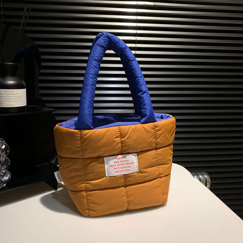 Internet celebrity hot autumn and winter space cotton bag, women's style fresh candy color handle bucket bag wholesale 2024 new casual fashion tr