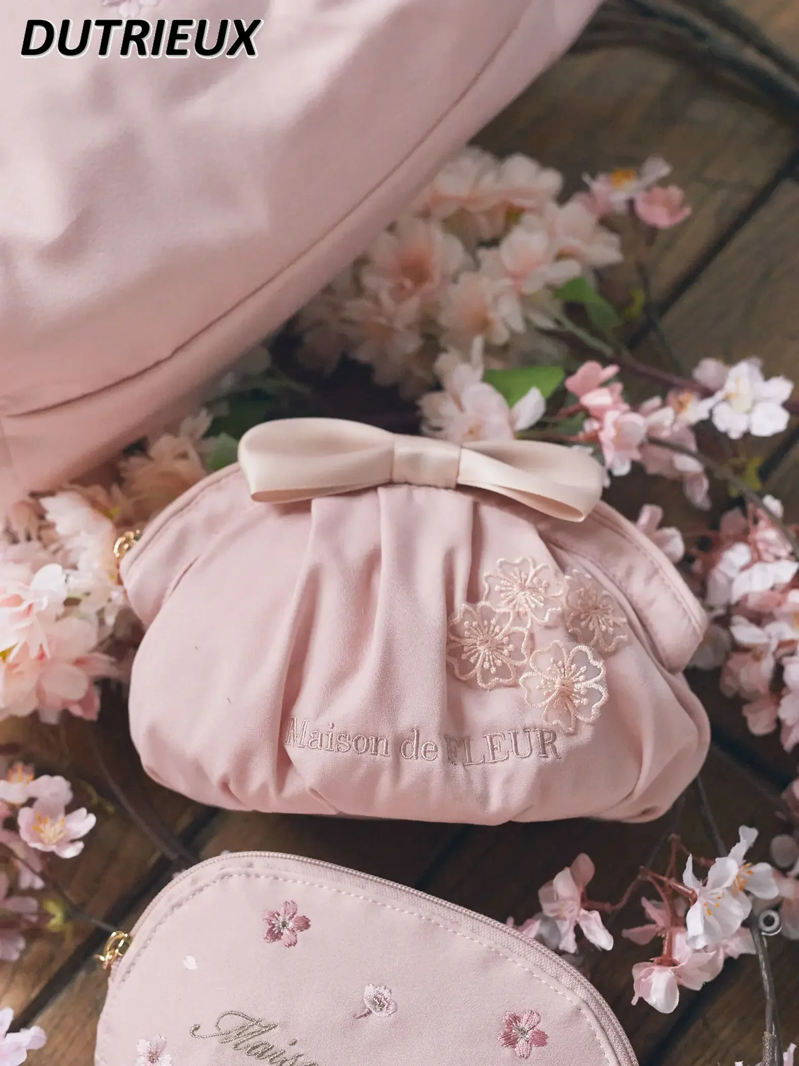Womens handbag Japanese style spring and summer hand-held dumplings bow satin womens makeup bag cute makeup bag 241212