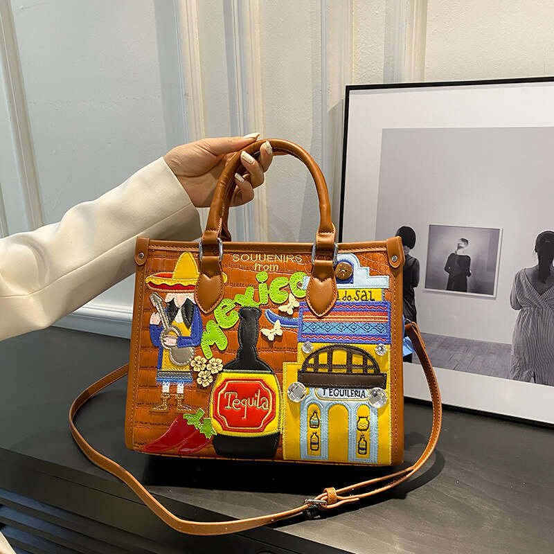Large capacity handbag with female niche design, Mexican style adhesive fabric embroidery graffiti single shoulder crossbody bag, 2024 new casual vers