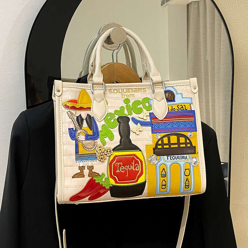 Large capacity handbag with female niche design, Mexican style adhesive fabric embroidery graffiti single shoulder crossbody bag, 2024 new casual vers