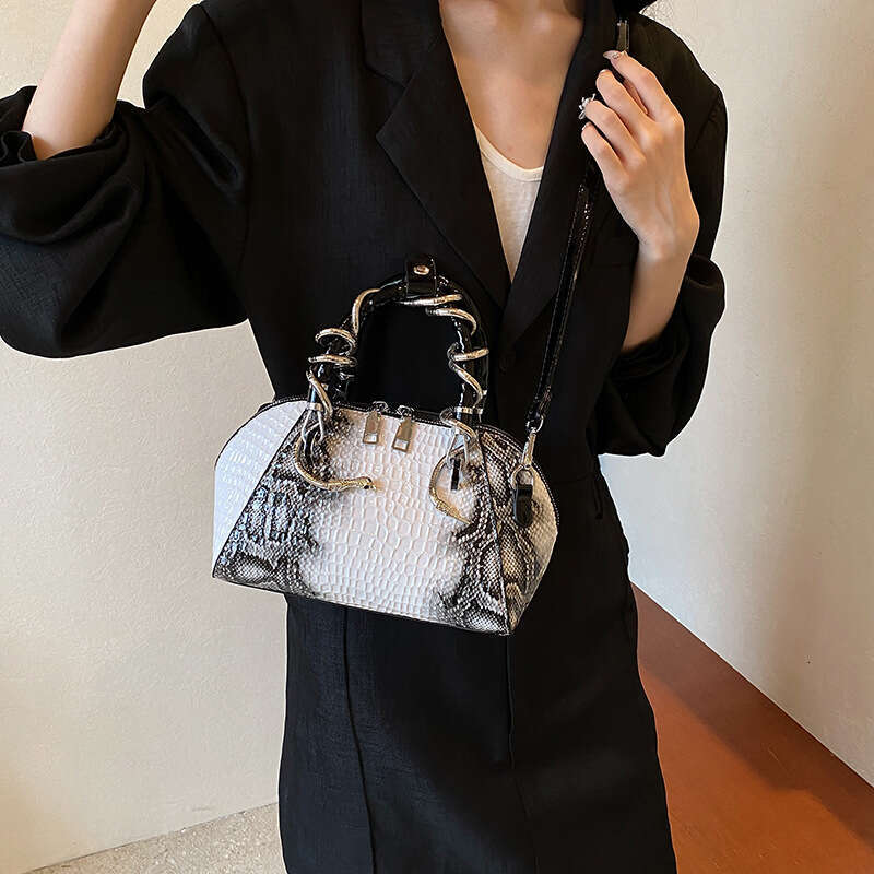 Advanced women's spicy girl style retro snake pattern hand-held shell temperament commuting single shoulder crossbody bag 2024 new casual versati