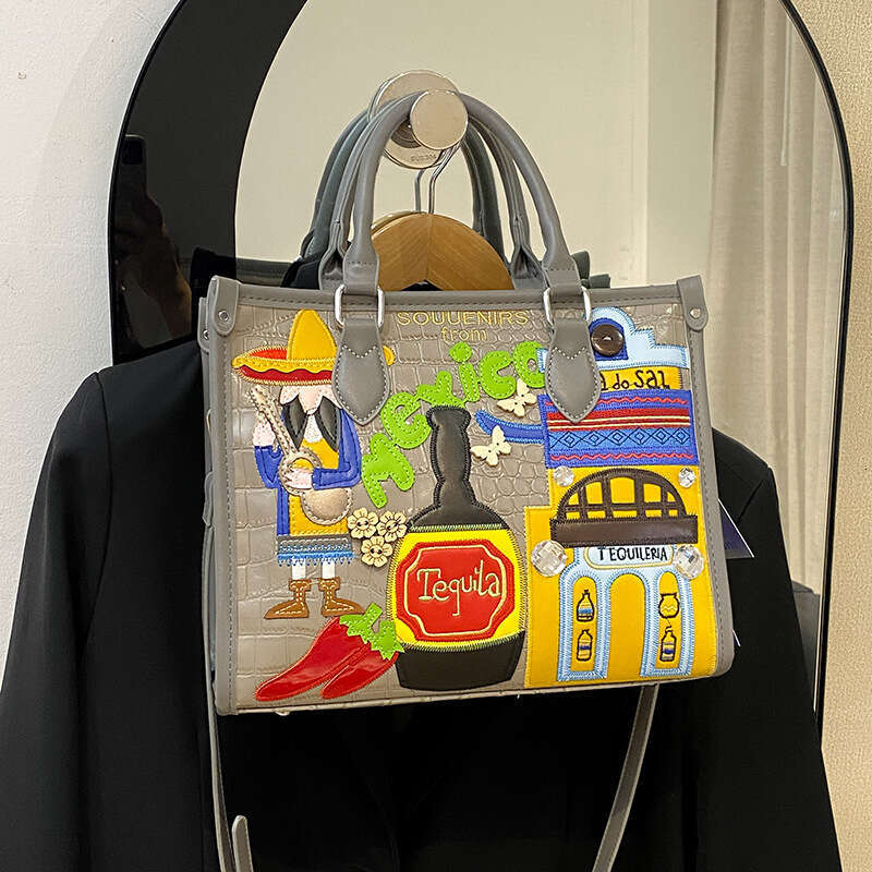 Large capacity handbag with female niche design, Mexican style adhesive fabric embroidery graffiti single shoulder crossbody bag, 2024 new casual vers