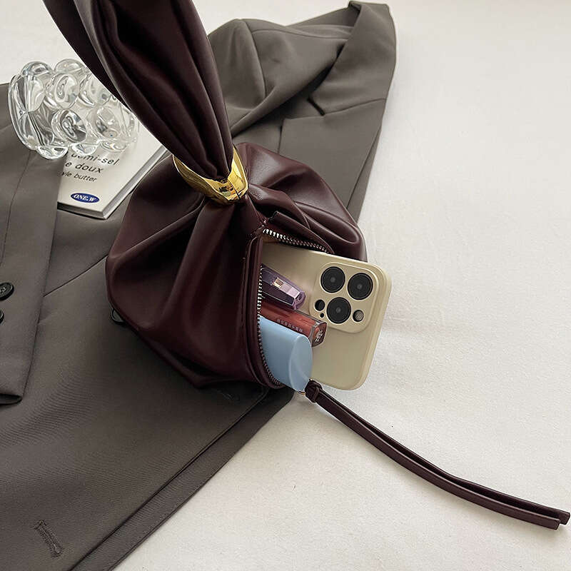 Small design, high grade women's unique mouth binding bucket lucky handbag, hot girl, hand held zi bag, 2024 new style, chic and elegant clothing