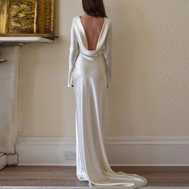White satin long sleeved slim evening dress sexy hollow backless mermaid dress autumn womens O-neck fashionable dress 241213