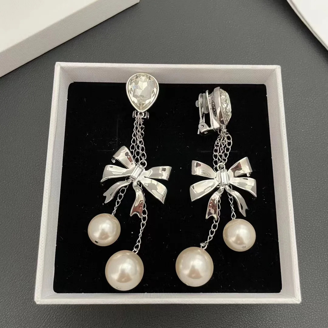 Small fringe long earrings butterfly pearl crystal Europe and the United States exaggerated wind ear clip 241220