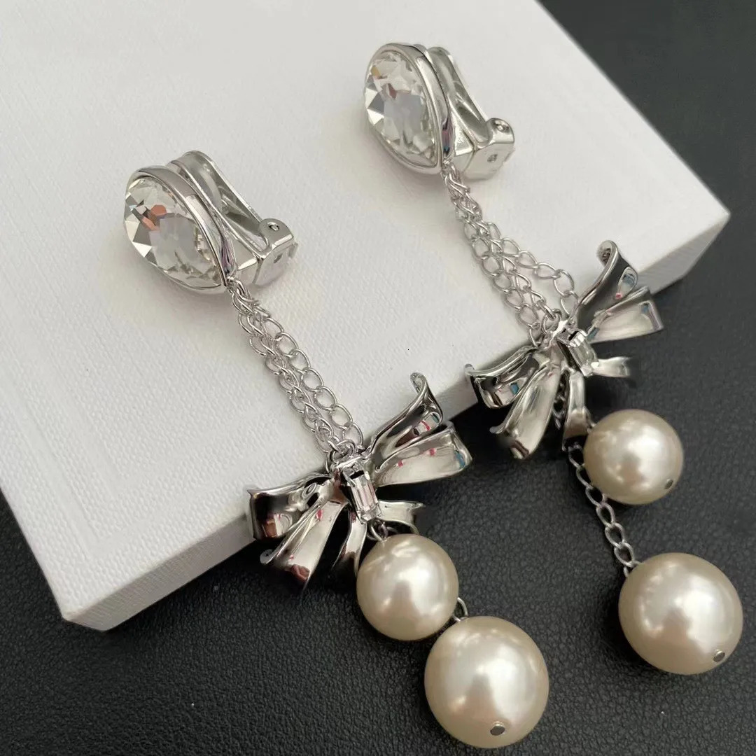 Small fringe long earrings butterfly pearl crystal Europe and the United States exaggerated wind ear clip 241220