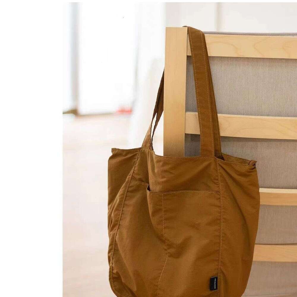 Canvas women's waterproof nylon casual shoulder cloth bag, niche design sense, large capacity commuting tote bag