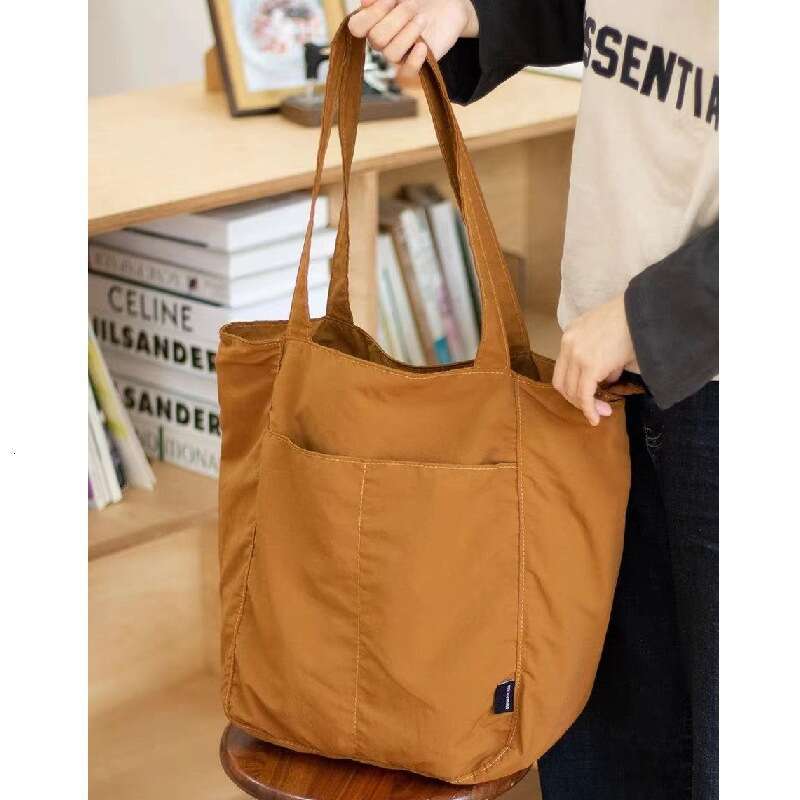 Canvas women's waterproof nylon casual shoulder cloth bag, niche design sense, large capacity commuting tote bag