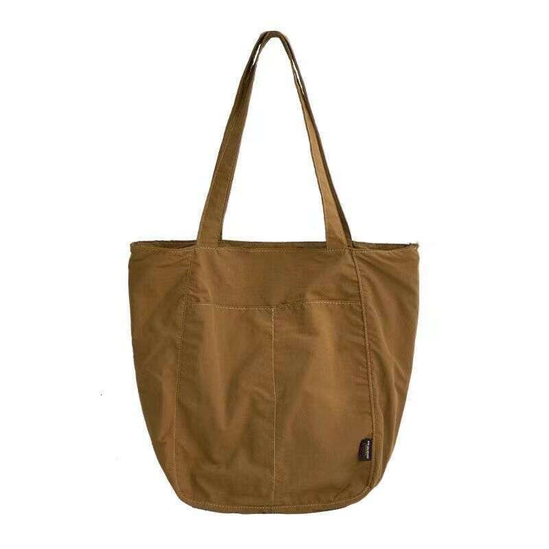 Canvas women's waterproof nylon casual shoulder cloth bag, niche design sense, large capacity commuting tote bag