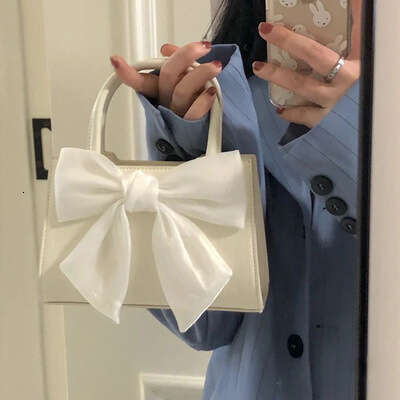 Bow commuting handbag 2024 new fashionable and high-quality small square bag, sweet girl single shoulder diagonal cross bag