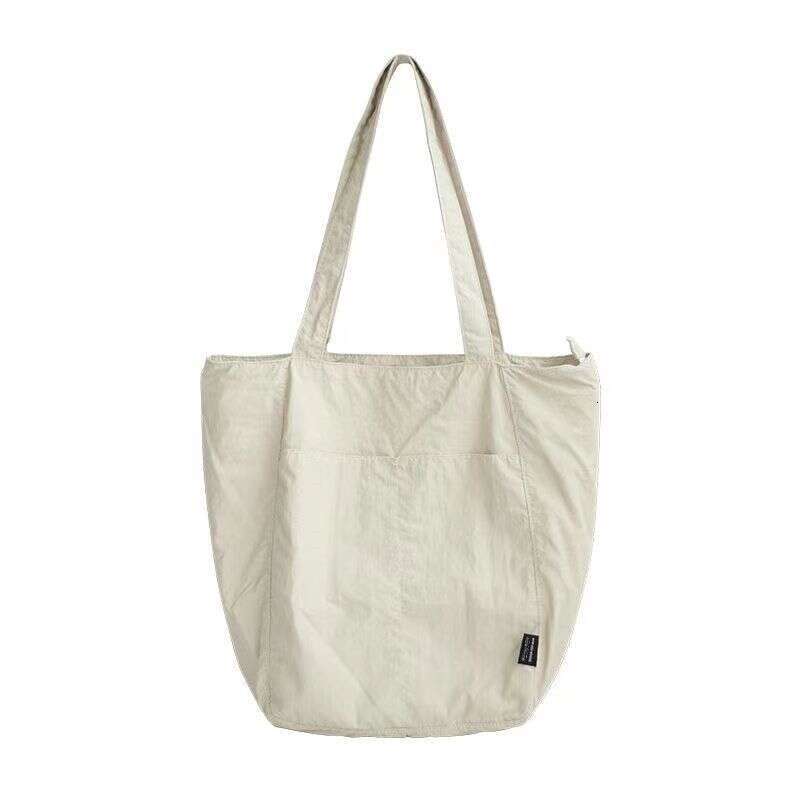 Canvas women's waterproof nylon casual shoulder cloth bag, niche design sense, large capacity commuting tote bag
