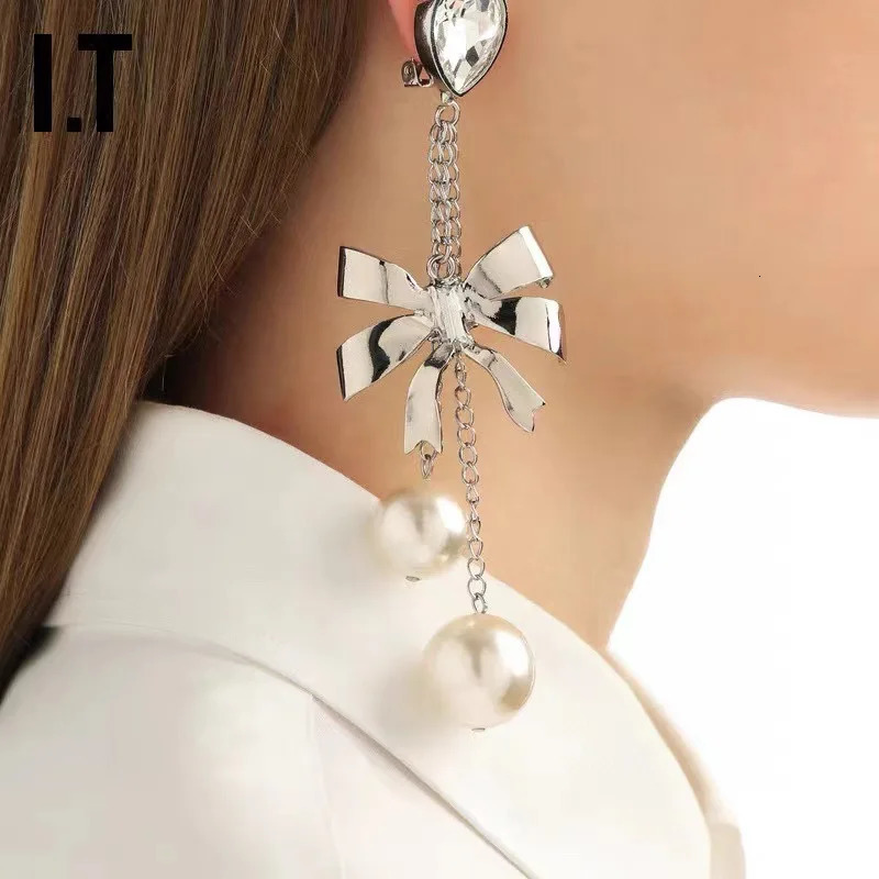 Small fringe long earrings butterfly pearl crystal Europe and the United States exaggerated wind ear clip 241220