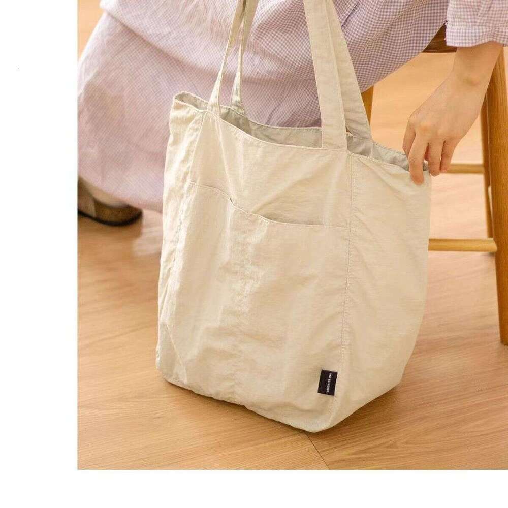 Canvas women's waterproof nylon casual shoulder cloth bag, niche design sense, large capacity commuting tote bag