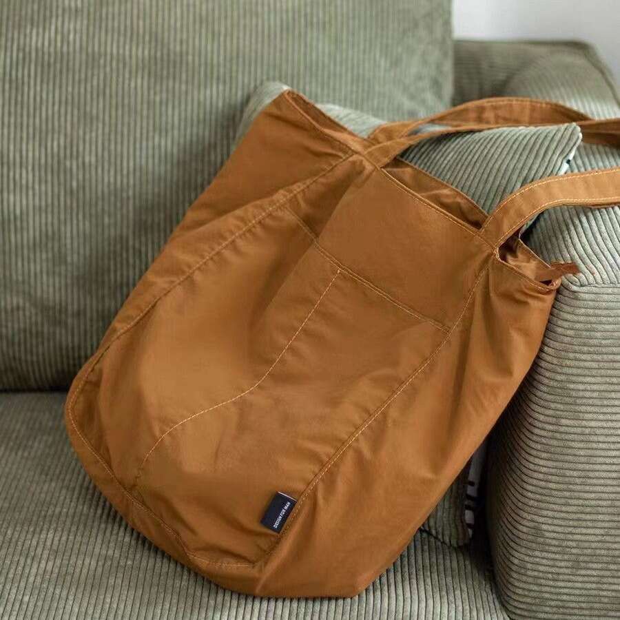Canvas women's waterproof nylon casual shoulder cloth bag, niche design sense, large capacity commuting tote bag