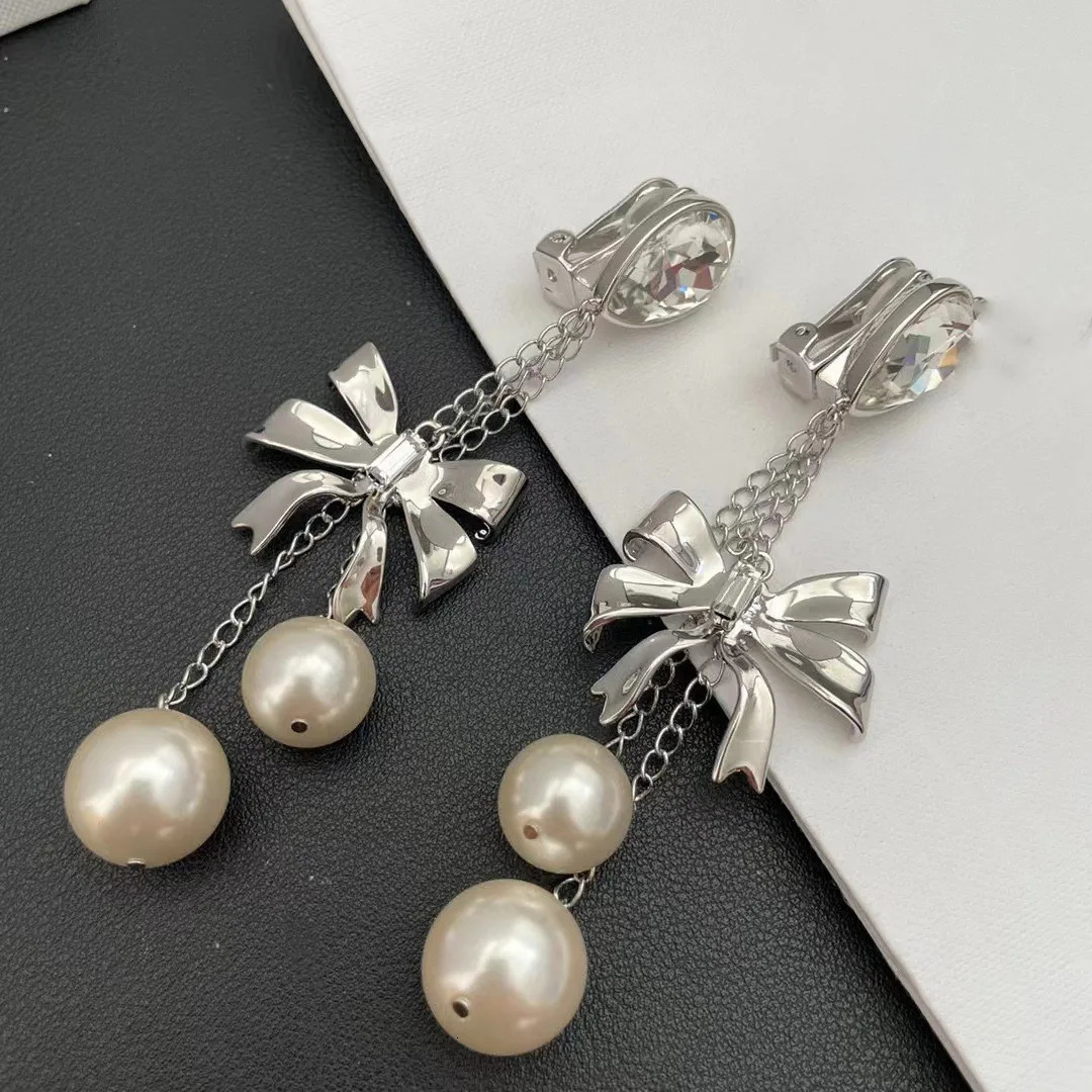 Small fringe long earrings butterfly pearl crystal Europe and the United States exaggerated wind ear clip 241220