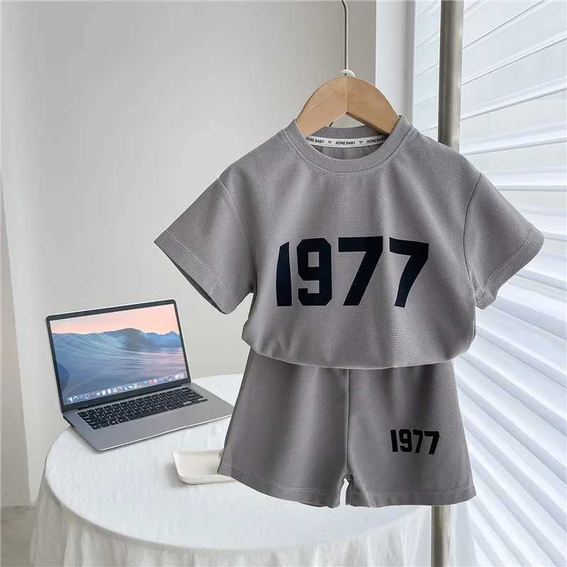 Clothing Sets Trendy Solid Color Two Piece Sets Summer Clothing Girls And Boys Casual Loose Short Sleeve Tshirt+Shorts Fashion Sports 2pcsY241225PAI2