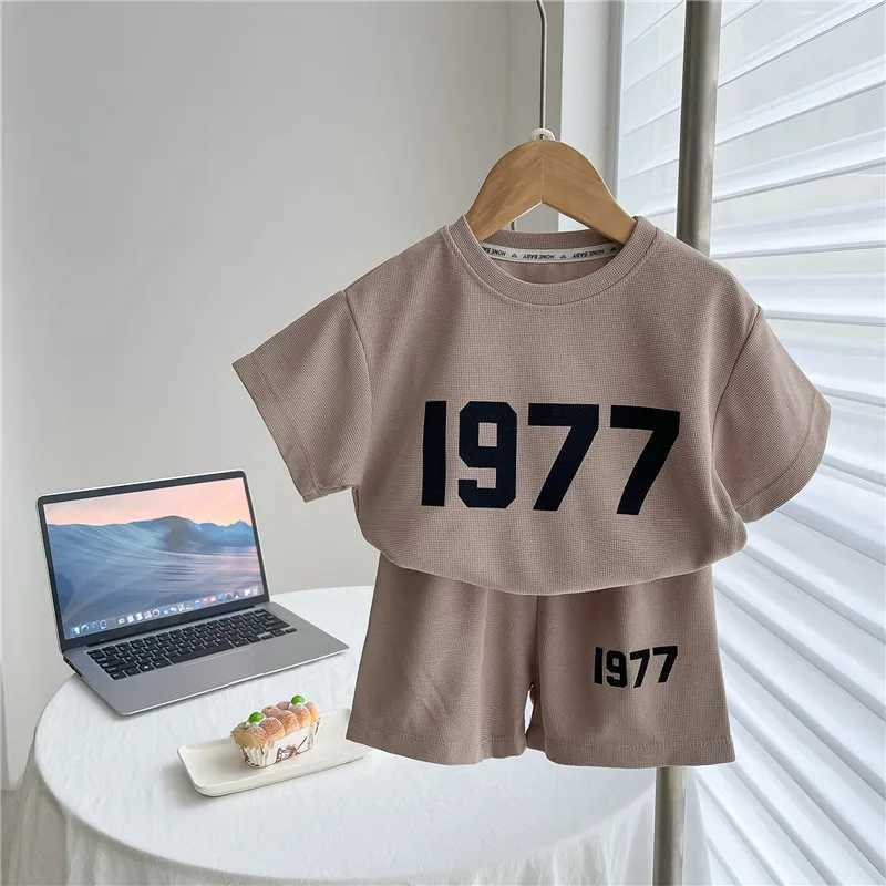 Clothing Sets Trendy Solid Color Two Piece Sets Summer Clothing Girls And Boys Casual Loose Short Sleeve Tshirt+Shorts Fashion Sports 2pcsY241225PAI2