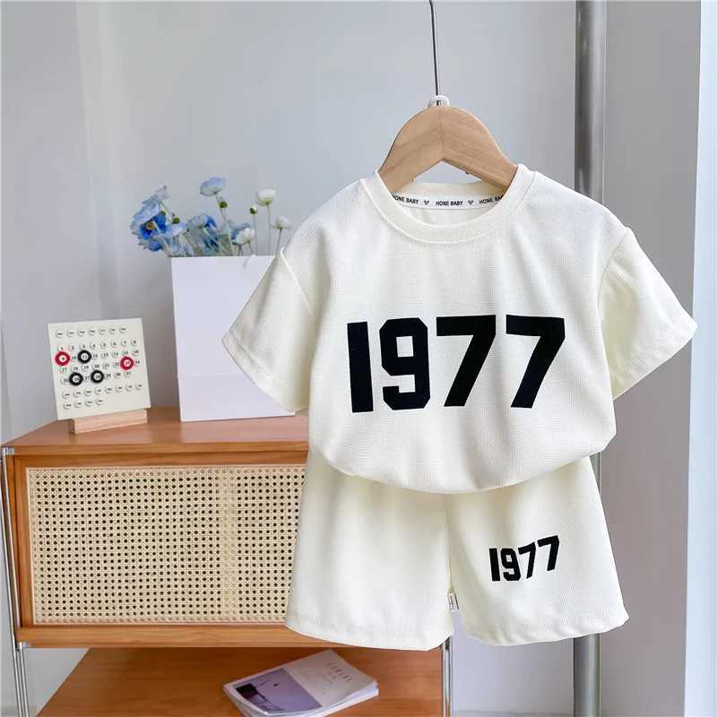 Clothing Sets Trendy Solid Color Two Piece Sets Summer Clothing Girls And Boys Casual Loose Short Sleeve Tshirt+Shorts Fashion Sports 2pcsY241225PAI2