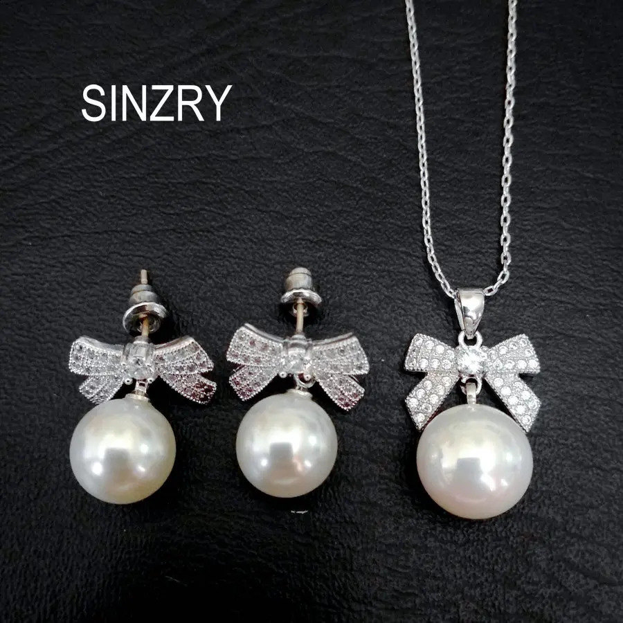 SINZRY Korean jewelry white color cubic zircon bowknot simulated pearl pendant necklace earring jewelry set christmas gift 241226