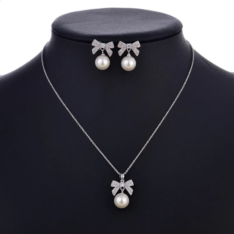 SINZRY Korean jewelry white color cubic zircon bowknot simulated pearl pendant necklace earring jewelry set christmas gift 241226