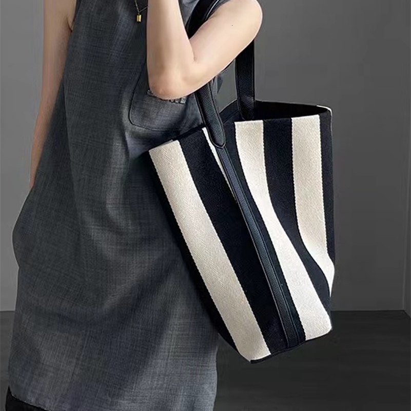 Niche striped canvas bucket bag for women large capacity lazy style commuting tote bag2024 single shoulder trend 241203