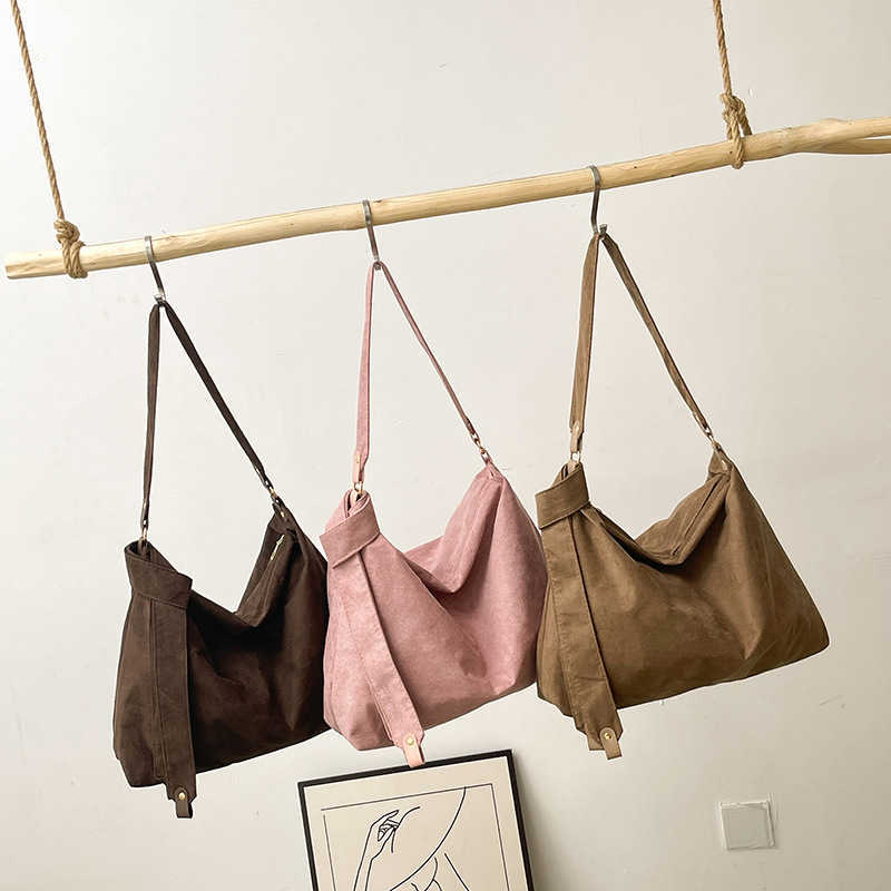 Windy suede solid color design for commuting, large capacity, simple temperament, women's single shoulder armpit bag 241231