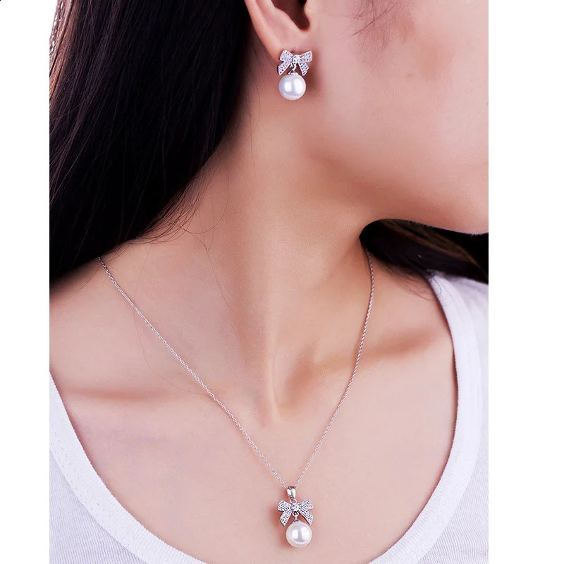 SINZRY Korean jewelry white color cubic zircon bowknot simulated pearl pendant necklace earring jewelry set christmas gift 241226
