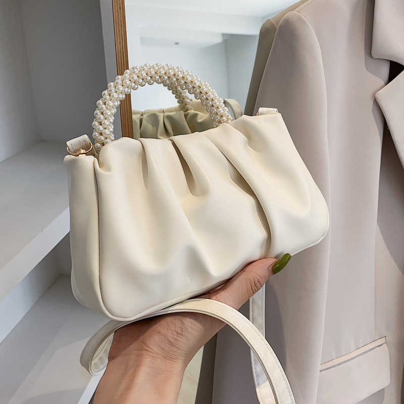 Solid women's bag 2022 summer new cloud bag fashion soft face portable bag simple foreign style single shoulder diagonal bag