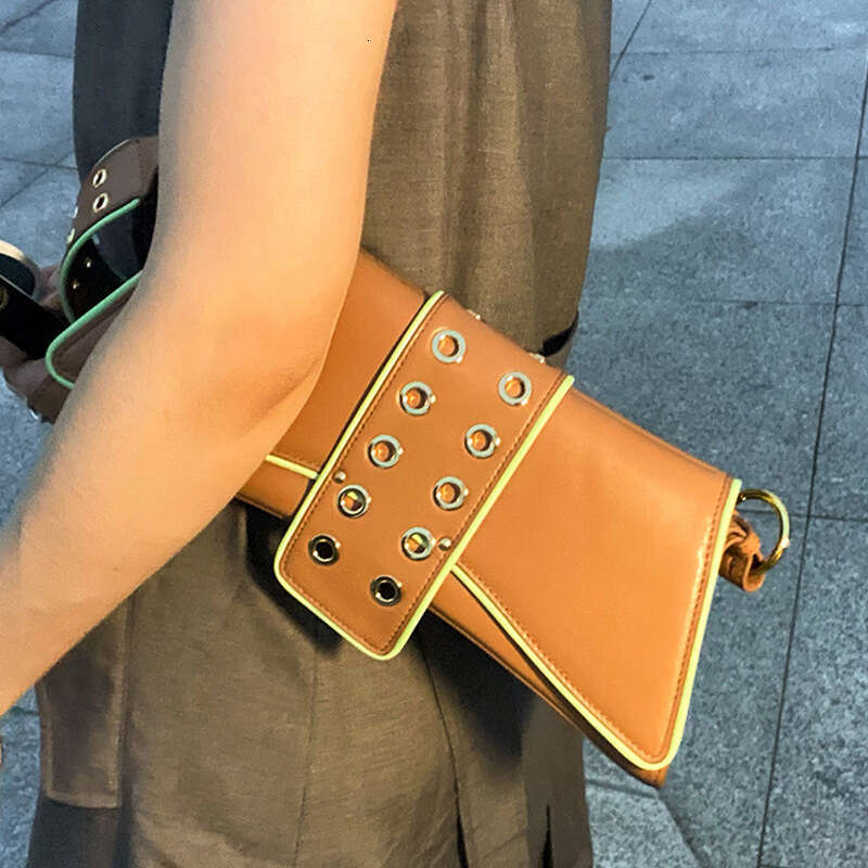 2025 New Bag Niche Dark Heavy Industry Porous Contrasting Color Patent Leather Armpit Single shoulder Crossbody Bag