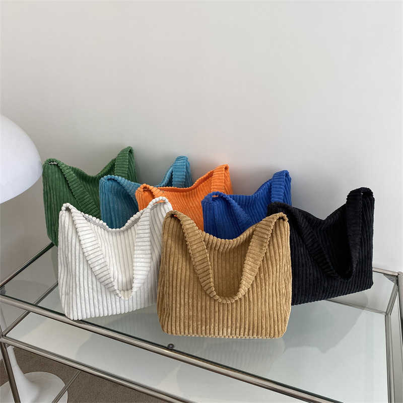 In 2023, corduroy tote bags will be launched as large capacity shoulder bags for college students attending classes 241230