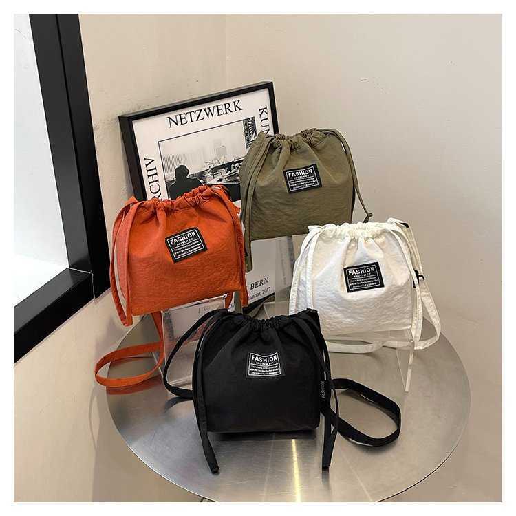 Japanese and Korean Artistic Single Shoulder Crossbody Bag Drawstring Small Bag Niche Solid Color Fashionable Lightweight Mini Phone Nylon Bag for Wom