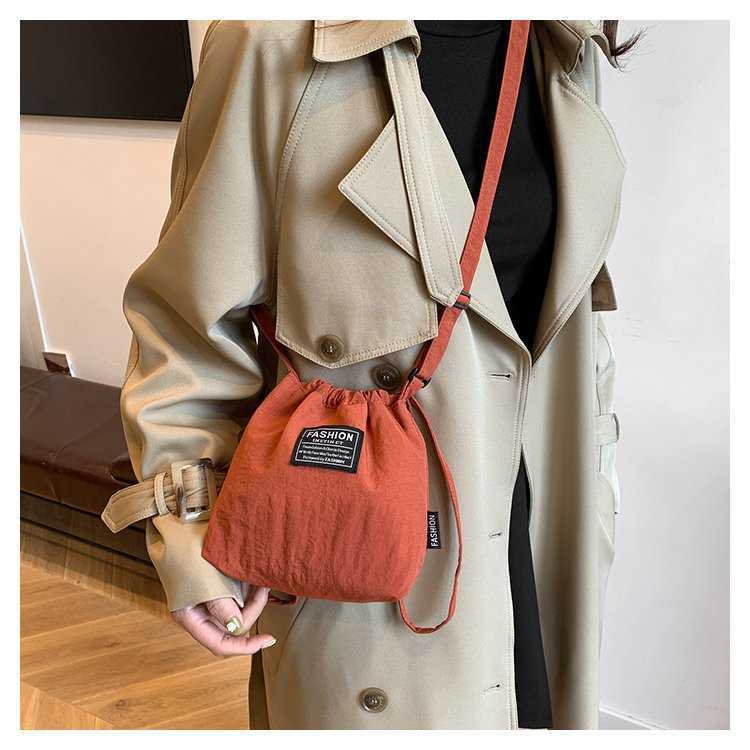 Japanese and Korean Artistic Single Shoulder Crossbody Bag Drawstring Small Bag Niche Solid Color Fashionable Lightweight Mini Phone Nylon Bag for Wom