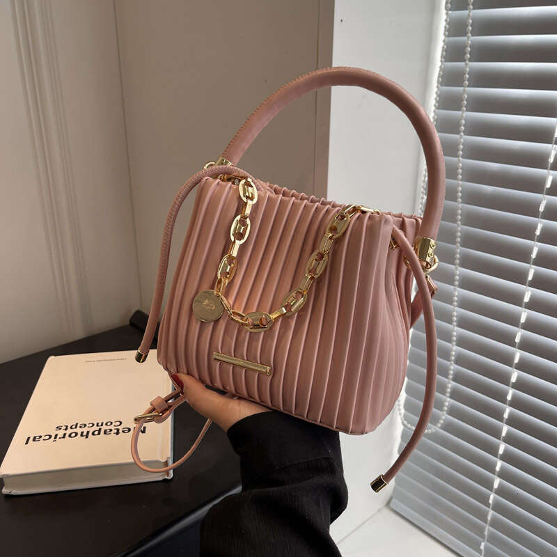Small niche design for women in spring trendy single shoulder crossbody bag, portable simple pleated bucket bags