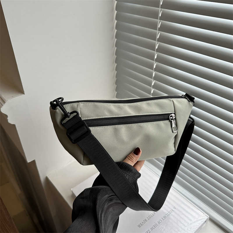 Trendy, casual, simple, lightweight, and stylish 2024 candy colored large capacity new diagonal small backpack sports shoulder bag 241230