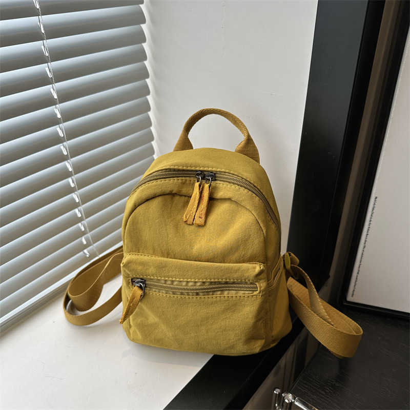 Nylon fabric casual 2024 new Korean version solid color travel simple backpack couple large capacity fashionable small backpack for women 241230