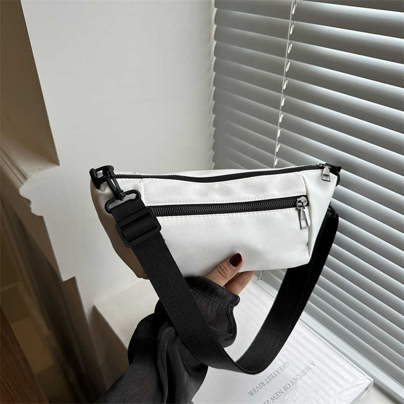 Trendy, casual, simple, lightweight, and stylish 2024 candy colored large capacity new diagonal small backpack sports shoulder bag 241230