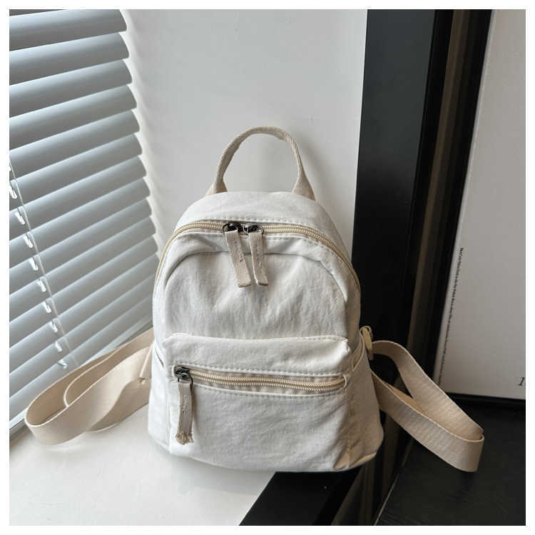 Nylon fabric casual 2024 new Korean version solid color travel simple backpack couple large capacity fashionable small backpack for women 241230