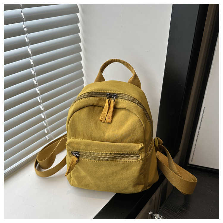 Nylon fabric casual 2024 new Korean version solid color travel simple backpack couple large capacity fashionable small backpack for women 241230