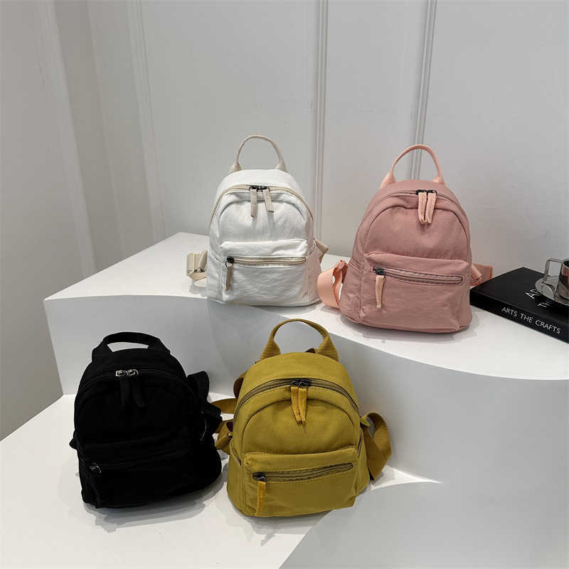 Nylon fabric casual 2024 new Korean version solid color travel simple backpack couple large capacity fashionable small backpack for women 241230