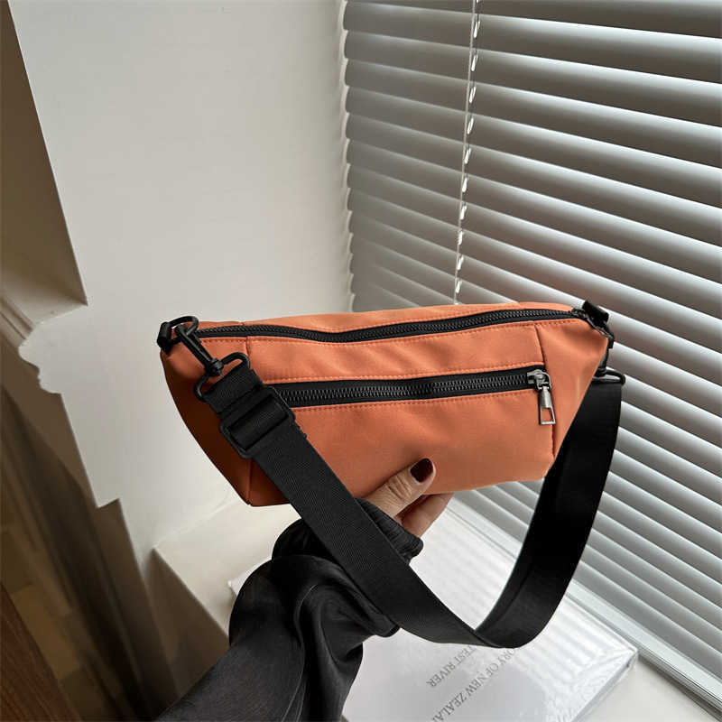 Trendy, casual, simple, lightweight, and stylish 2024 candy colored large capacity new diagonal small backpack sports shoulder bag 241230