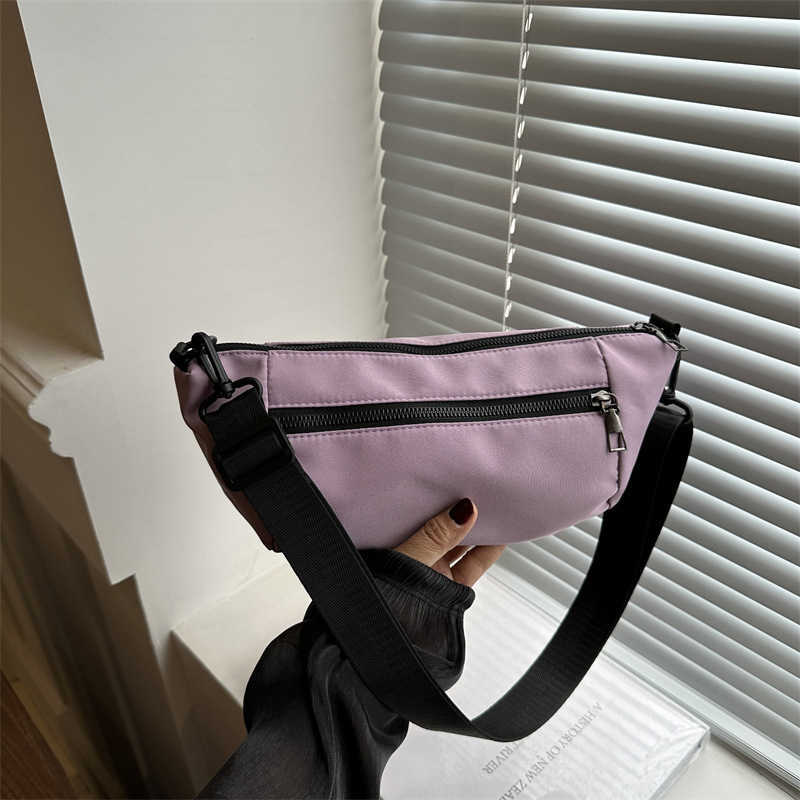 Trendy, casual, simple, lightweight, and stylish 2024 candy colored large capacity new diagonal small backpack sports shoulder bag 241230